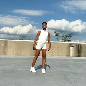 “Keep it Cute” White Sleeveless Child-ish Clothing One piece Zipper Romper.